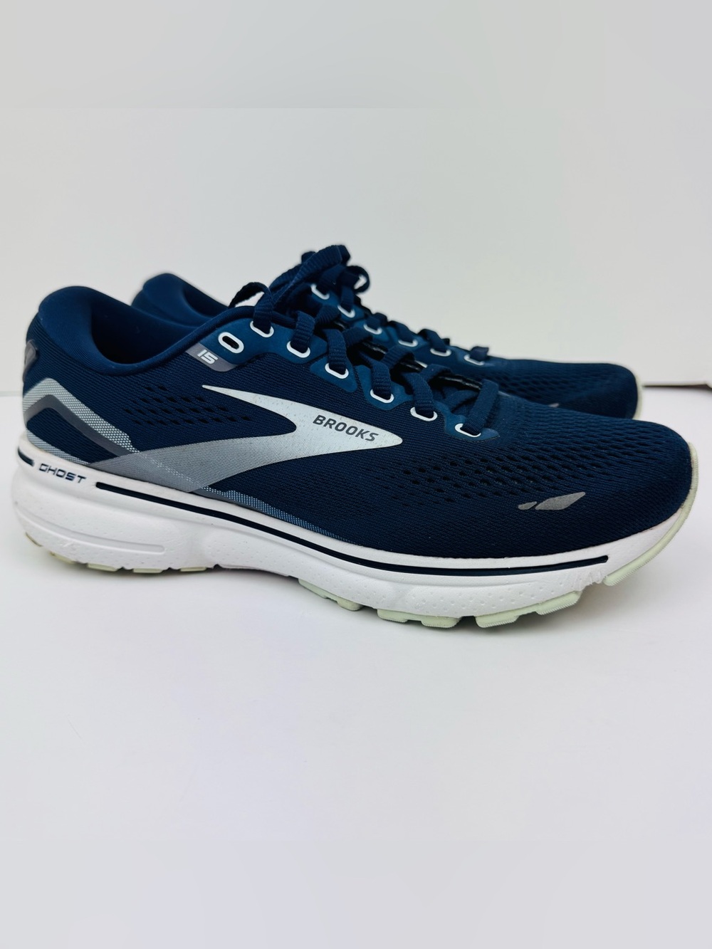 Brooks Ghost 15 running shoes. Navy blue, white, gray. Women’s size 7W.